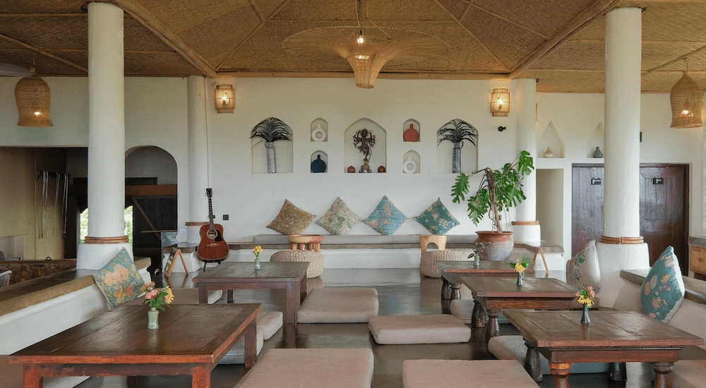 Ashtari Restaurant lounge corner. A mix of Moroccan and Western minimalist interior design. Comfy throw pillows and low seating areas.