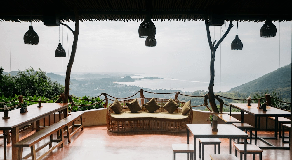 Restaurant seaside view at Ashtari with couch in the middle of the terrace