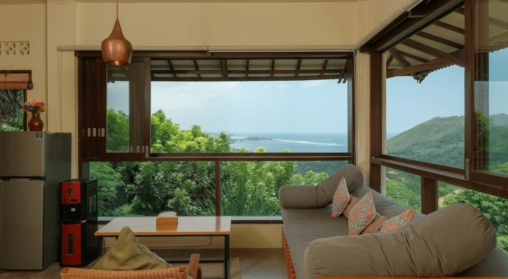 Loft Living room, couches pointed at the beautiful big window, showcasing the unique sea side view. 