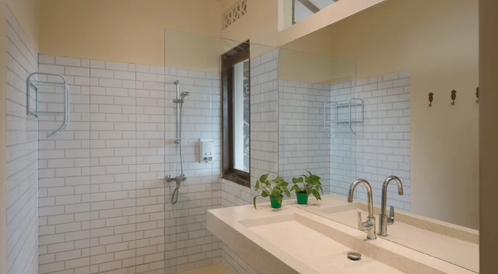 The loft bathroom has been recently renovated and is equipped with a big modern shower, and a full wall length sink and mirror.